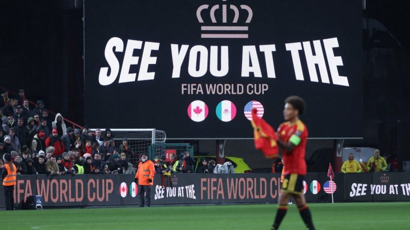 GettyImages 2247356158: Business professionals in a conference room discussing industry trends and strategies.