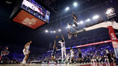 Breaking news event with a diverse group of professionals discussing current market trends in a modern office setting