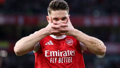 Dynamic cityscape with modern skyscrapers under a clear blue sky, highlighting urban development and economic growth