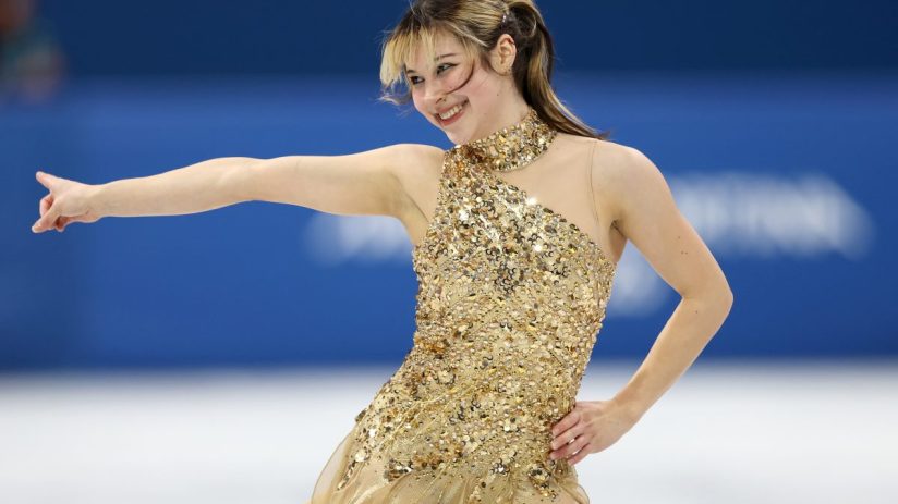 Business professionals in a meeting discussing a new strategic plan, seated around a conference table with digital present...
