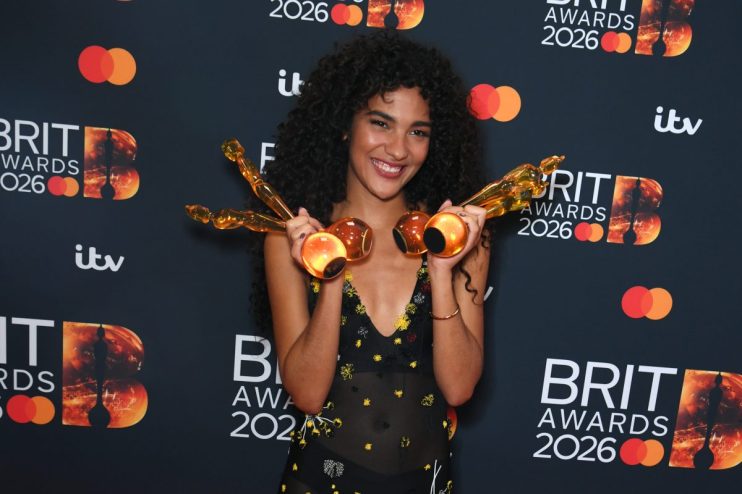 GettyImages 2263600046 features a dynamic scene with diverse professionals collaborating in a modern business environment.