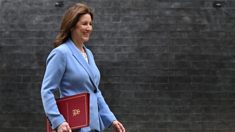 GettyImages 2264549868 featuring a prominent business executive at a corporate conference, engaged in a panel discussion.