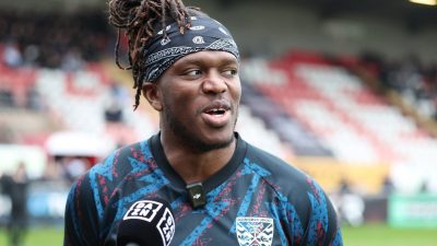 GettyImages news context: dynamic city skyline at dusk with illuminated skyscrapers reflecting modern urban development