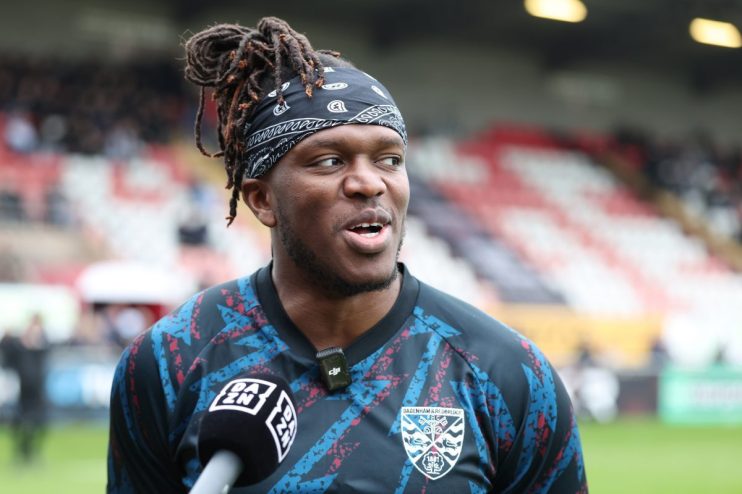 GettyImages news context: dynamic city skyline at dusk with illuminated skyscrapers reflecting modern urban development
