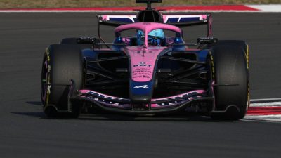 GettyImages 2266265013 showcasing a significant business event, featuring executives in a formal setting with a city skyli...