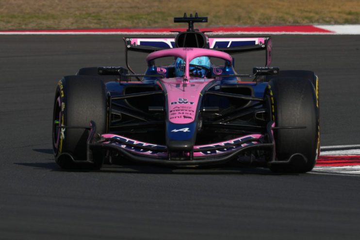 GettyImages 2266265013 showcasing a significant business event, featuring executives in a formal setting with a city skyli...