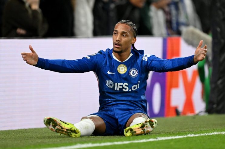 Business professionals discussing strategic plans in a modern conference room setting with digital charts displayed on a s...