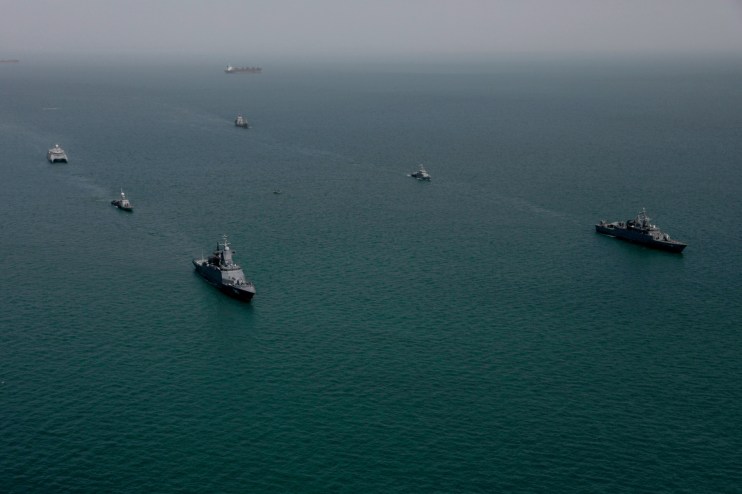 Investec logo displayed prominently, symbolizing financial services expertise and corporate identity in business news context