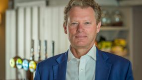 Jonathan Neame, Chief Executive of Shepherd Neame, discussing business strategies and company growth in a professional set...