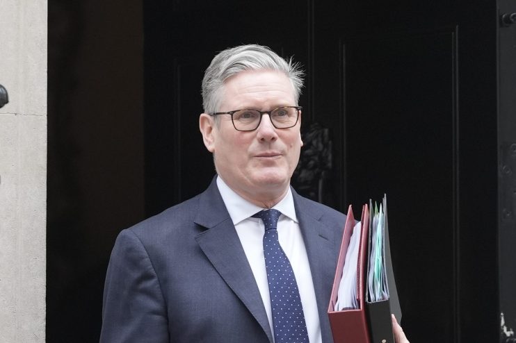 Keir Starmer prepares for Prime Ministers Questions in Parliament, showcasing confidence and leadership ahead of the session.