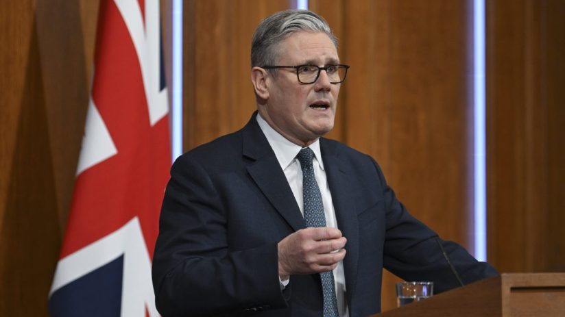 Keir Starmer delivering a speech at a public event, emphasizing policy changes and leadership strategies, with a focused a...