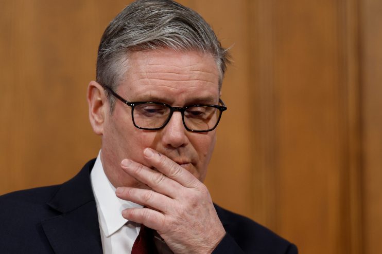 Keir Starmer outside Downing Street, engaging with media amidst significant political discussions