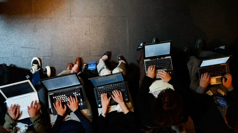 Modern laptops and desktop computers arranged on a sleek workspace, highlighting latest tech trends in digital devices.