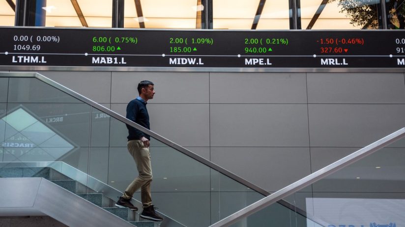 FTSE index numbers displayed on electronic board at London Stock Exchange showing current market trends and performance