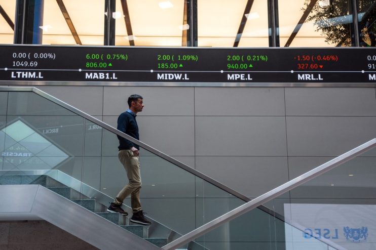 FTSE index numbers displayed on electronic board at London Stock Exchange showing current market trends and performance