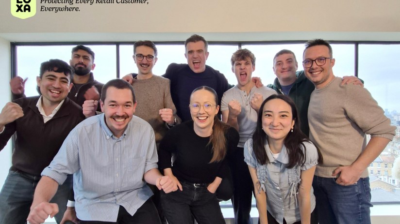 Loxa Team celebrating successful seed fundraise in their modern London office, fostering innovation and teamwork.