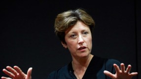 Katharine Braddick appointed as new PRA chief, smiling confidently in business attire at press conference backdrop