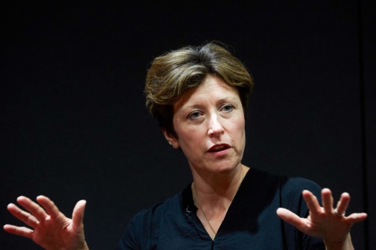 Katharine Braddick appointed as new PRA chief, smiling confidently in business attire at press conference backdrop