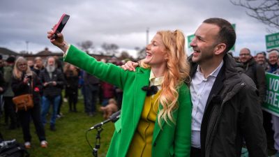 Roman Polanski and Kristen Spencer discuss film collaboration at press conference, seated at table with microphones and ca...