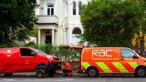 RAC logo prominently displayed on a modern office building facade under a clear blue sky