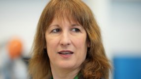 Rachel Reeves delivering a speech at a press conference, addressing economic policies and financial strategies.