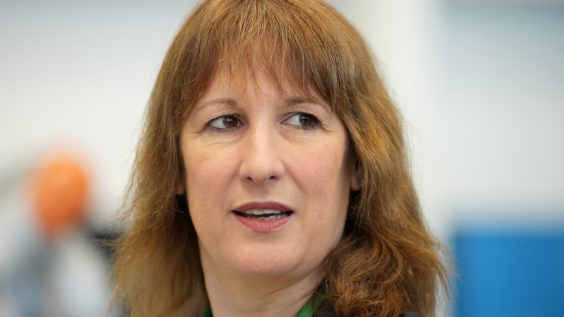 Rachel Reeves delivering a speech at a press conference, addressing economic policies and financial strategies.