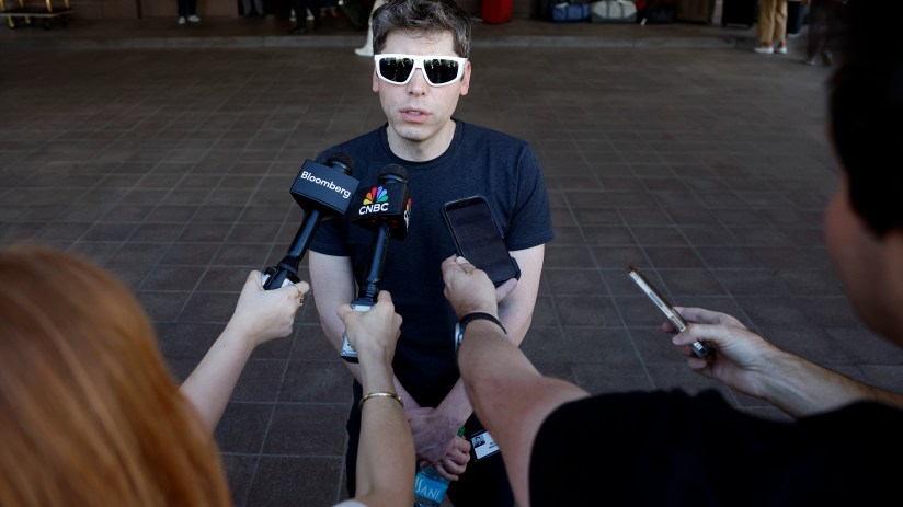 Sam Altman discussing advancements in ChatGPT AI technology at a business conference.