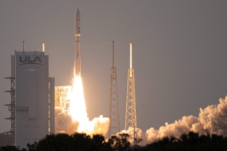 Satellite being launched into space against a twilight sky, showcasing cutting-edge technology and aerospace innovation