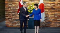 Keir Starmer and Sanae Takaichi in discussion during a diplomatic meeting, highlighting UK-Japan relations and cooperation.