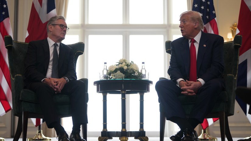 Keir Starmer and Donald Trump engaging in a discussion at a political event, highlighting UK-US relations in 2023.