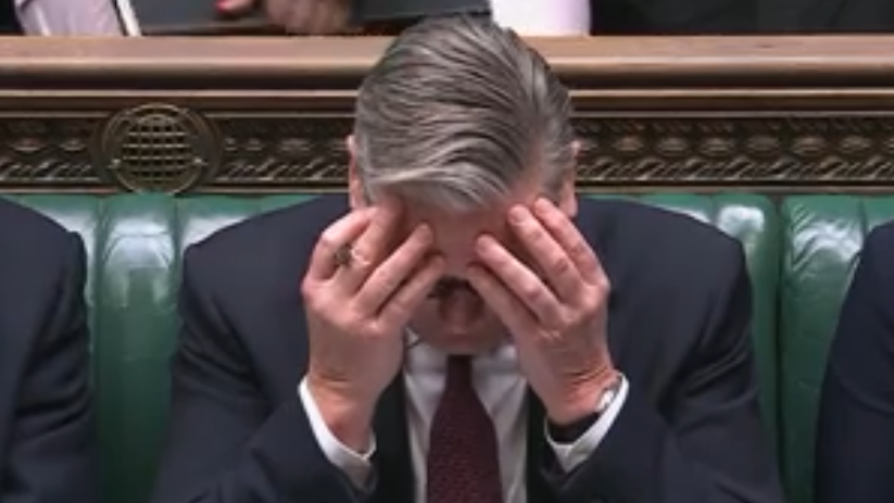 Keir Starmer speaking at Prime Ministers Questions in the UK Parliament, addressing key issues with government officials.
