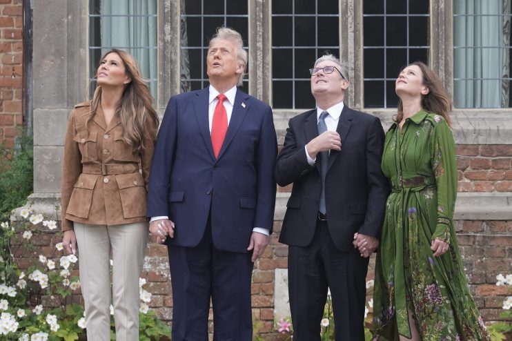 Donald Trump and Keir Starmer engaged in discussion at a high-profile political event, capturing international media atten...