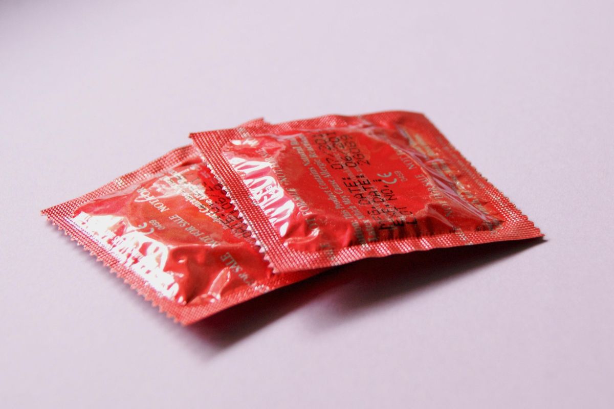 Tradesmen hand condoms to politicians in paternity campaign