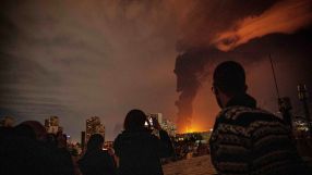 Breaking news graphic with bold text and abstract design elements on a digital backdrop, emphasizing timely updates