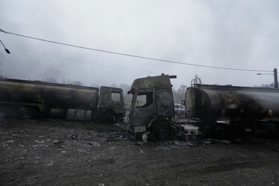 Two burned oil tanker trucks after US-Israel strikes on Iran. (Image: PA)
