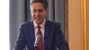 Ed Miliband speaking at clean energy summit, addressing renewable energy strategies and climate action initiatives.