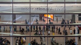 Aerial view of Heathrow Airports bustling terminals with parked airplanes and surrounding infrastructure