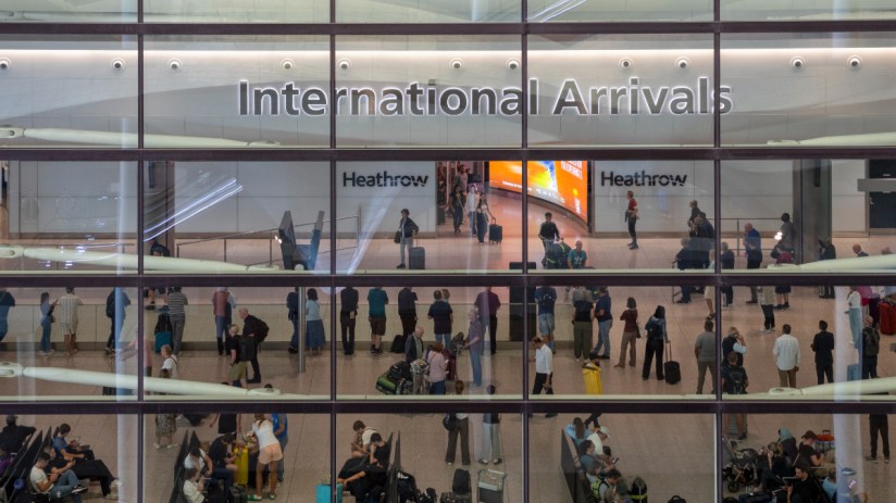 Aerial view of Heathrow Airports bustling terminals with parked airplanes and surrounding infrastructure