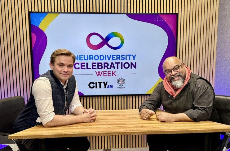 Atif and Martin discussing business strategies at a conference table, highlighting collaboration in a professional setting