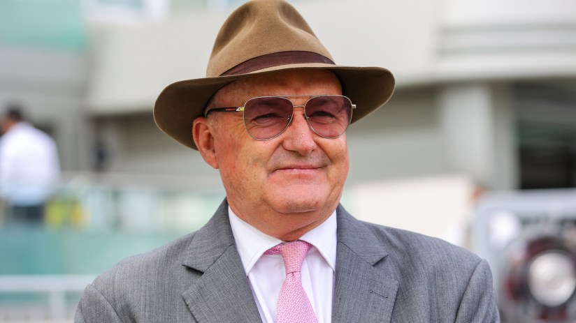 Breaking news scene with reporters gathered outside a government building, capturing the buzz of urgent journalism activity.