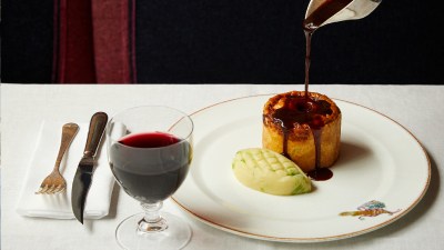 Freshly baked pie with golden crust on a wooden table, highlighting culinary craftsmanship in a general news article context