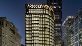 Sleek modern design of Revoluts new office space featuring open workstations and collaborative meeting areas