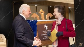 Sir Henry Angest with HRH, formal business attire, engaging in discussion at a corporate event, highlighting leadership ex...