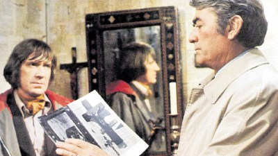 Dramatic scene from The Omen featuring a suspenseful moment with intense expressions and moody lighting.