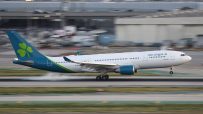 Aer Lingus aircraft on runway at sunrise, highlighting airlines operations and fleet in vibrant morning hues.