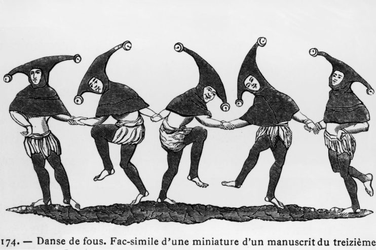 Playful April Fools Day prank with office workers wearing colorful costumes and surprised expressions in a corporate setting.