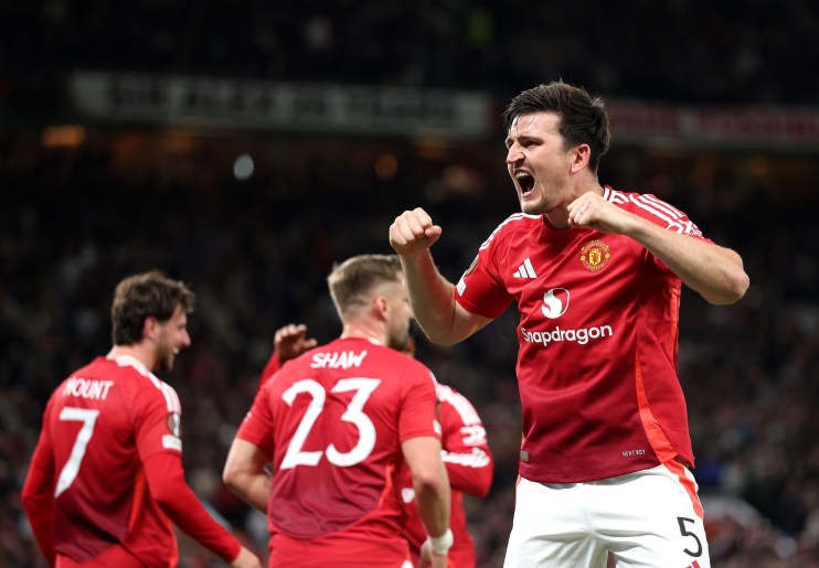 Getty Images logo displayed on a smartphone screen against a blurred background of various colorful digital images.