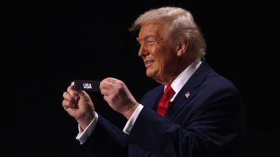 GettyImages 2250239946 depicts a businessperson analyzing financial charts and graphs on a digital tablet, emphasizing dat...