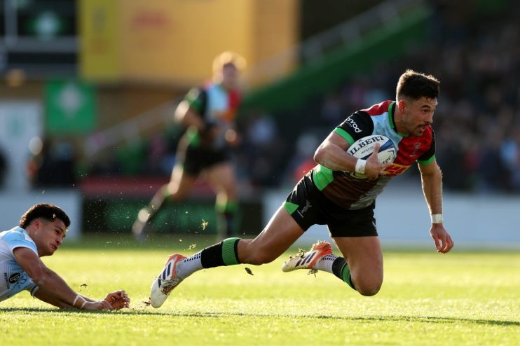 Breaking news event with reporters and cameras gathered, capturing a significant moment in a bustling urban setting.