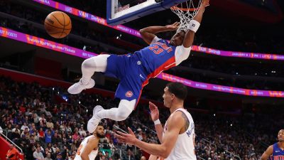 Getty Images logo on a digital screen with abstract financial charts and data, representing modern business trends and ins...